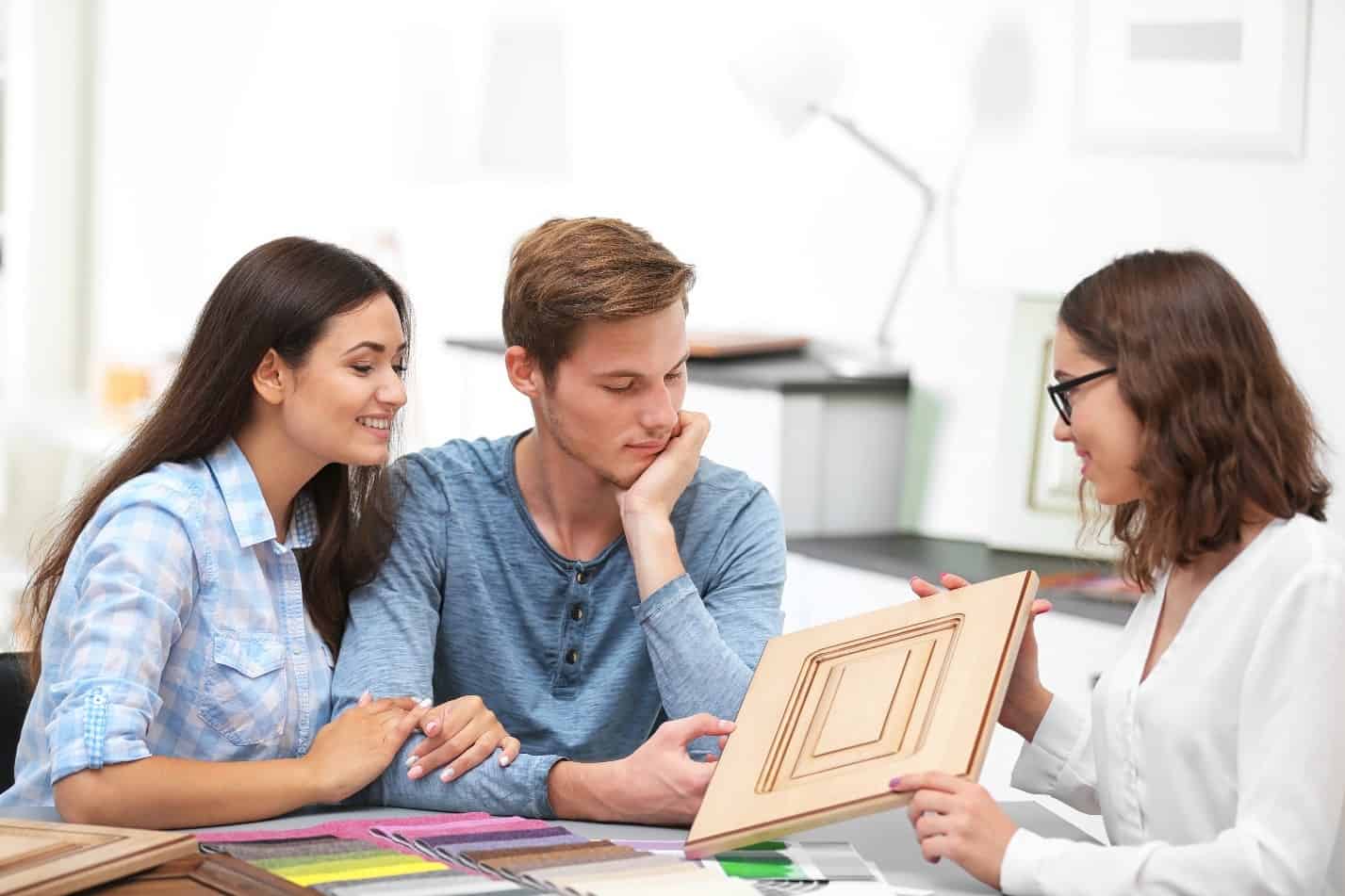 A couple talking to a closet designer.