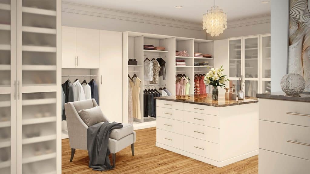 A luxurious walk-in closet by Closets by Design.