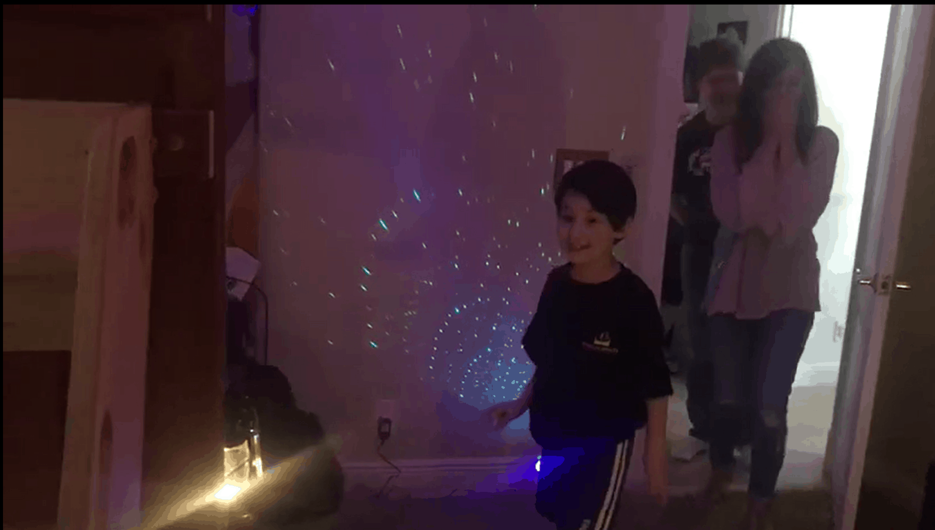 Slater and his family seeing his new room from Closets by Design for the first time.